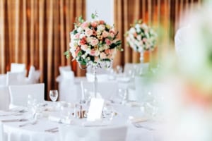 Beautiful wedding tables and roses in bouquet