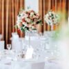 Beautiful wedding tables and roses in bouquet